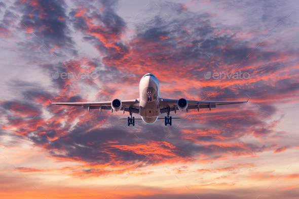 Landing Passenger Airplane At Colorful Sunset Stock Photo By Den Belitsky